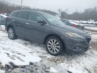 2014 Mazda CX-9 Grand Touring with VIN JM3TB3DV9E0440506, listed as a IAAI auction lot 41537718 with 217,299 mi miles and . Bid and sale history available at DreamBid. Image 1.