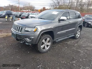 2014 Jeep Grand Cherokee Overland with VIN 1C4RJFCG5EC329377, listed as a IAAI auction lot 40822324 with 106,222 mi miles. Bid and sale history available at carsss.com. Image 20.