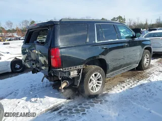 2019 Chevrolet Tahoe LT with VIN 1GNSKBKC7KR138999, listed as a IAAI auction lot 41339420 with 74,297 mi miles. Bid and sale history available at carsss.com. Image 4.