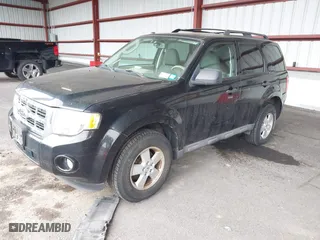 2009 Ford Escape XLT with VIN 1FMCU93G79KC30405, listed as a IAAI auction lot 42043034 with 136,086 mi miles. Bid and sale history available at carsss.com. Image 2.