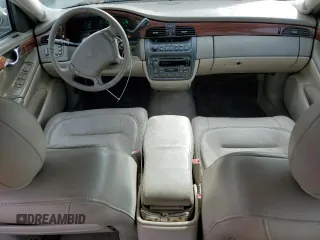 2001 Cadillac DeVille z VIN 1G6KD54Y61U248616, wystawiony jako Copart lot #47057095 z przebiegiem 110 009 mil mil oraz Czysty tytuł • Clean title. Historia ofert i sprzedaży dostępna na DreamBid. Obrazek 8.