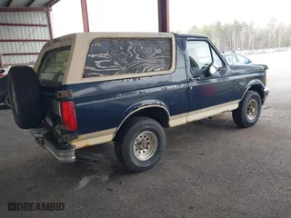 1993 Ford Bronco XL with VIN 1FMEU15N1PLB29714, listed as a IAAI auction lot 41984437 with 165,195 mi miles. Bid and sale history available at carsss.com. Image 4.