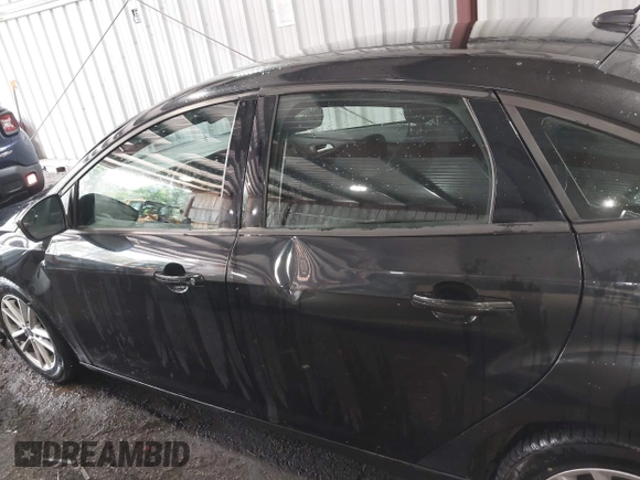 2015 Ford Focus SE with VIN 1FADP3F25FL216205, listed as a IAAI auction lot 42425478 with 124,117 mi miles and . Bid and sale history available at DreamBid. Image 14.