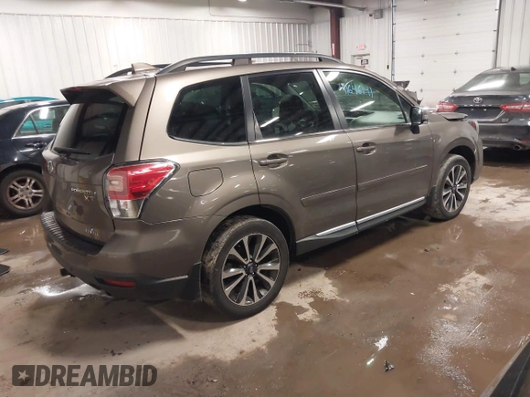 2017 Subaru Forester Touring with VIN JF2SJGWC0HH810100, listed as a IAAI auction lot 41646141 with 69,556 mi miles. Bid and sale history available at carsss.com. Image 4.
