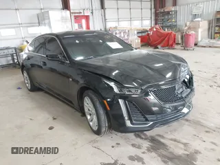 2021 Cadillac CT5 Luxury z VIN 1G6DX5RK0M0147667, wystawiony jako IAAI lot #41398726 z przebiegiem 50 387 mil mil oraz . Historia ofert i sprzedaży dostępna na DreamBid. Obrazek 1.
