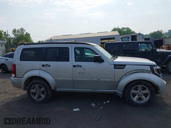 2010 Dodge Nitro SXT z VIN 1D4PU5GK8AW146087, wystawiony jako IAAI lot #42423104 z przebiegiem 220 381 mil mil oraz . Historia ofert i sprzedaży dostępna na DreamBid. Obrazek 13.