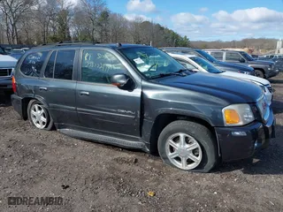 2005 GMC Envoy Denali with VIN 1GKET63M052336214, listed as a IAAI auction lot 41852417 with 999,999 mi miles. Bid and sale history available at carsss.com. Image 1.