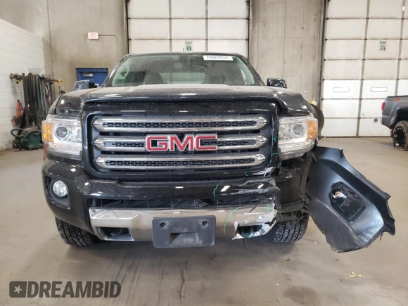 2015 GMC Canyon 4WD SLE with VIN 1GTH6BE32F1168788, listed as a Copart auction lot 76972934 with 158,562 mi miles and Salvage Title. Bid and sale history available at carsss.com. Image 5.