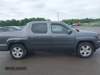2014 Honda Ridgeline RTL with VIN 5FPYK1F5XEB011772, listed as a IAAI auction lot 42440390 with 145,219 mi miles and . Bid and sale history available at DreamBid. Image 13.