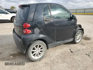 2009 Smart fortwo Pure with VIN WMEEJ31X19K267800, listed as a Copart auction lot 77392744 with 100,178 mi miles and Salvage Title. Bid and sale history available at carsss.com. Image 3.