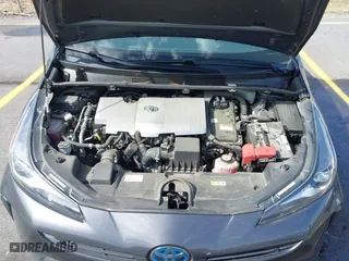 2021 Toyota Prius L Eco with VIN JTDKAMFU4M3134778, listed as a IAAI auction lot 41843429 with 145,757 mi miles. Bid and sale history available at carsss.com. Image 10.