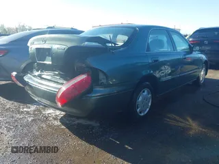1998 Mazda 626 DX with VIN 1YVGF22C4W5768778, listed as a IAAI auction lot 41971066 with 119,168 mi miles. Bid and sale history available at carsss.com. Image 4.