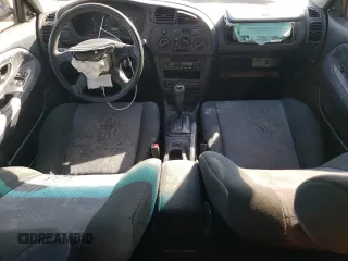 2002 Mitsubishi Mirage DE z VIN JA3AY11A02U013027, wystawiony jako Copart lot #73217194 z przebiegiem 155 865 mil mil oraz Szkoda całkowita • Salvage title. Historia ofert i sprzedaży dostępna na DreamBid. Obrazek 8.