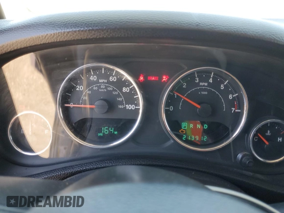 2014 Jeep Wrangler Unlimited Sport with VIN 1C4HJWDG1EL221302, listed as a Copart auction lot 63331015 with 213,912 mi miles and Salvage title. Bid and sale history available at DreamBid. Image 9.