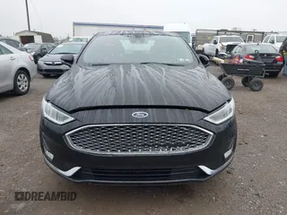 2019 Ford Fusion Titanium with VIN 3FA6P0D92KR125864, listed as a IAAI auction lot 42425422 with 109,340 mi miles and . Bid and sale history available at DreamBid. Image 12.