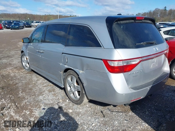 2011 Honda Odyssey Touring with VIN 5FNRL5H92BB049901, listed as a IAAI auction lot 41985224 with 101,957 mi miles and . Bid and sale history available at DreamBid. Image 3.