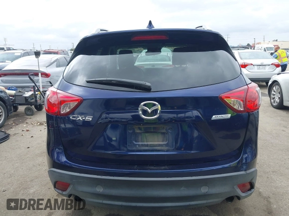 2014 Mazda CX-5 Grand Touring with VIN JM3KE2DY1E0307911, listed as a IAAI auction lot 42064898 with 133,934 mi miles. Bid and sale history available at carsss.com. Image 17.