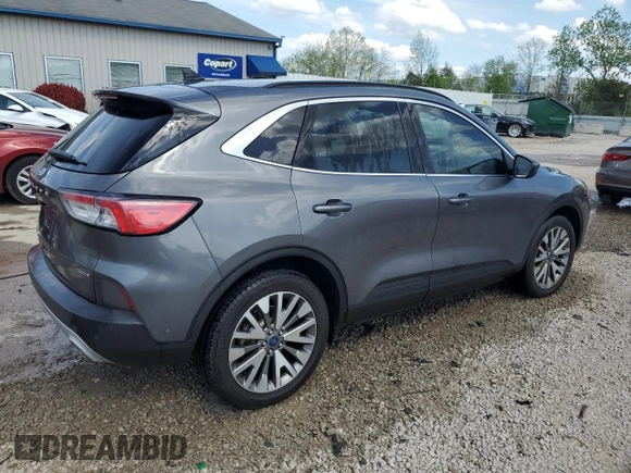 2021 Ford Escape Titanium Hybrid z VIN 1FMCU9DZ4MUA56645, wystawiony jako Copart lot #54059515 z przebiegiem 31 432 mil mil oraz Szkoda całkowita • Salvage title. Historia ofert i sprzedaży dostępna na DreamBid. Obrazek 3.