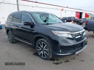 2020 Honda Pilot Elite with VIN 5FNYF6H00LB011658, listed as a IAAI auction lot 41626828 with 34,341 mi miles and . Bid and sale history available at DreamBid. Image 1.
