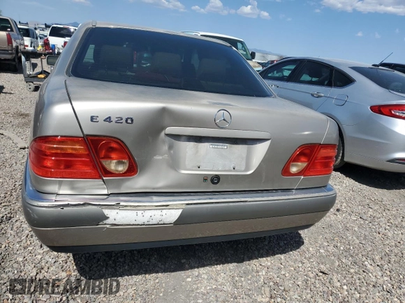 1997 Mercedes-Benz E-Class with VIN WDBJF72F2VA274233, listed as a Copart auction lot 74123554 with 80,914 mi miles and Salvage Title. Bid and sale history available at carsss.com. Image 6.