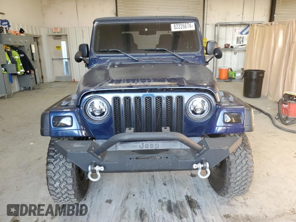 2006 Jeep Wrangler SE with VIN 1J4FA29126P705827, listed as a Copart auction lot 82226674 with 165,632 mi miles and Salvage Title. Bid and sale history available at carsss.com. Image 5.