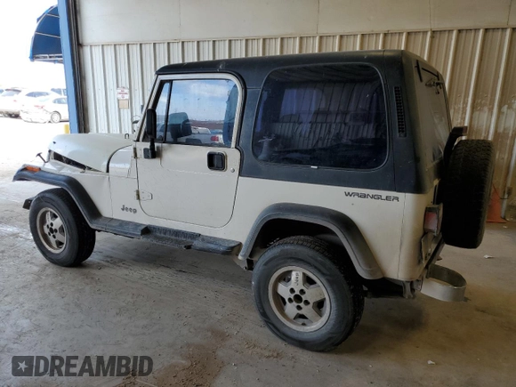 1995 Jeep Wrangler with VIN 1J4FY29SXSP309742, listed as a Copart auction lot 82399484 with 167,866 mi miles and Salvage Title. Bid and sale history available at carsss.com. Image 2.