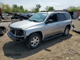 2006 GMC Envoy SLE z VIN 1GKDT13S662171123, wystawiony jako Copart lot #56418255 z przebiegiem 106 777 mil mil oraz Szkody całkowita. Historia ofert i sprzedaży dostępna na DreamBid. Obrazek 1.