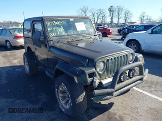 1997 Jeep Wrangler SE with VIN 1J4FY29P6VP438125, listed as a IAAI auction lot 41770455 with 163,001 mi miles. Bid and sale history available at carsss.com. Image 6.