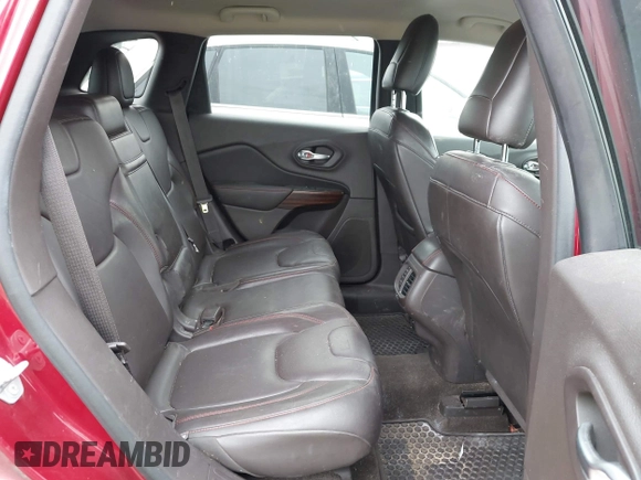 2015 Jeep Cherokee Trailhawk with VIN 1C4PJMBS6FW575517, listed as a IAAI auction lot 42661199 with 299,166 mi miles and . Bid and sale history available at DreamBid. Image 8.
