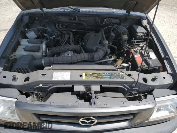 2005 Mazda B-Series Truck z VIN 4F4YR46U85PM05409, wystawiony jako Copart lot #58820575 z przebiegiem 127 258 mil mil oraz Szkoda całkowita • Salvage title. Historia ofert i sprzedaży dostępna na DreamBid. Obrazek 11.