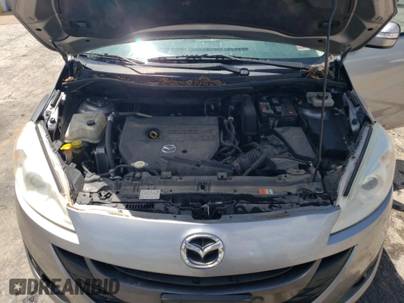 2015 Mazda 5 Touring z VIN JM1CW2CL4F0188463, wystawiony jako Copart lot #57597535 z przebiegiem 159 388 mil mil oraz Szkoda całkowita • Salvage title. Historia ofert i sprzedaży dostępna na DreamBid. Obrazek 12.