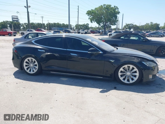 2014 Tesla Model S P85D with VIN 5YJSA1H25EFP65571, listed as a IAAI auction lot 42185442 with 115,990 mi miles and . Bid and sale history available at DreamBid. Image 12.