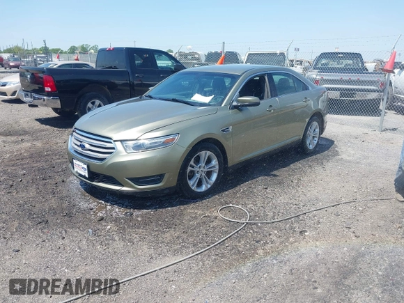 2013 Ford Taurus SEL with VIN 1FAHP2E88DG105557, listed as a IAAI auction lot 42040773 with 157,705 mi miles and . Bid and sale history available at carsss.com. Image 2.