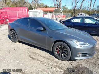 2017 Tesla Model S 100D with VIN 5YJSA1E27HF231755, listed as a IAAI auction lot 41351997 with 127,729 mi miles. Bid and sale history available at carsss.com. Image 1.