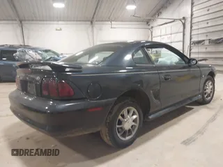 1997 Ford Mustang with VIN 1FALP4041VF157548, listed as a IAAI auction lot 39894591 with 146,891 mi miles. Bid and sale history available at carsss.com. Image 4.