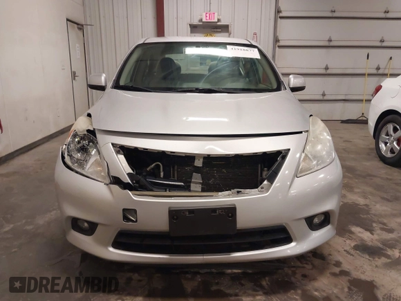 2012 Nissan Versa SV with VIN 3N1CN7AP2CL938479, listed as a IAAI auction lot 41918877 with 150,000 mi miles and . Bid and sale history available at DreamBid. Image 12.