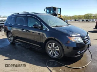 2014 Honda Odyssey Touring with VIN 5FNRL5H99EB088859, listed as a Copart auction lot 54828555 with 147,147 mi miles and Salvage Title. Bid and sale history available at DreamBid. Image 4.