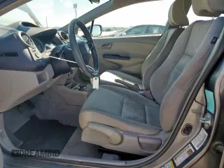2010 Honda Insight LX with VIN JHMZE2H56AS042097, listed as a Copart auction lot 53972215 with 107,182 mi miles and Salvage Title. Bid and sale history available at DreamBid. Image 7.