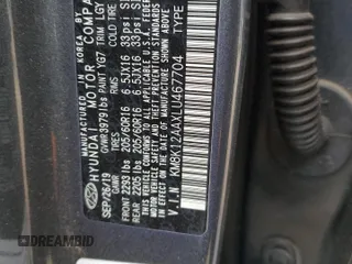 2020 Hyundai Kona SE with VIN KM8K12AAXLU467704, listed as a Copart auction lot 46981715 with 0 mi miles and Salvage Title. Bid and sale history available at carsss.com. Image 14.