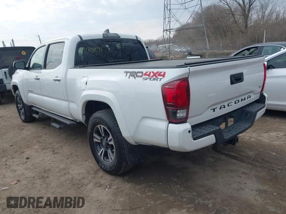 2018 Toyota Tacoma SR5 with VIN 3TMDZ5BN9JM051105, listed as a IAAI auction lot 41708034 with 98,000 mi miles and . Bid and sale history available at DreamBid. Image 3.