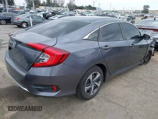 2020 Honda Civic LX with VIN 2HGFC2F64LH576765, listed as a IAAI auction lot 41881444 with 32,129 mi miles and . Bid and sale history available at DreamBid. Image 4.