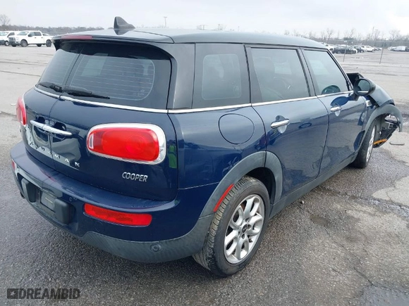 2016 MINI Cooper Clubman with VIN WMWLN5C54G2E30843, listed as a IAAI auction lot 41371368 with 1 mi miles. Bid and sale history available at carsss.com. Image 4.