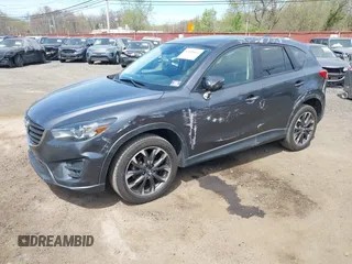 2016 Mazda CX-5 Grand Touring z VIN JM3KE4DY1G0893119, wystawiony jako IAAI lot #42049614 z przebiegiem 102 506 mil mil oraz . Historia ofert i sprzedaży dostępna na DreamBid. Obrazek 18.