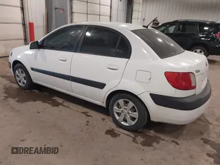 2009 Kia Rio SX with VIN KNADE223896533839, listed as a IAAI auction lot 41328220 with 140,968 mi miles. Bid and sale history available at carsss.com. Image 3.