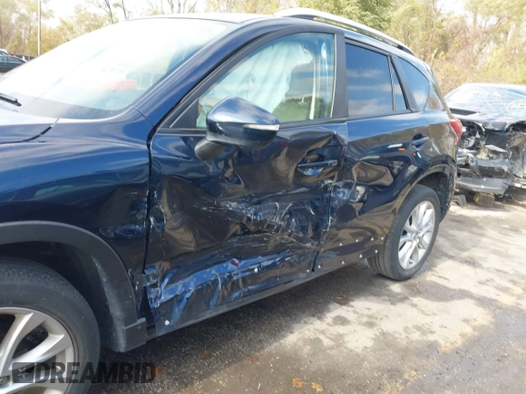 2015 Mazda CX-5 Grand Touring with VIN JM3KE4DY7F0478823, listed as a IAAI auction lot 40731626 with 82,884 mi miles. Bid and sale history available at carsss.com. Image 6.