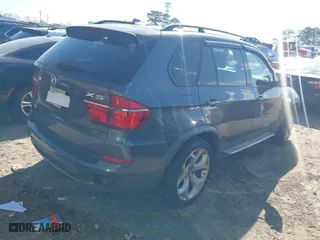2011 BMW X5 35i with VIN 5UXZV4C58BL410570, listed as a IAAI auction lot 41886238 with 164,192 mi miles. Bid and sale history available at carsss.com. Image 4.