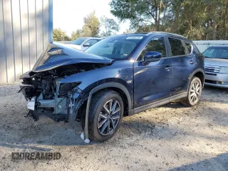 2018 Mazda CX-5 Touring with VIN JM3KFACM0J0413802, listed as a Copart auction lot 87550735 with 0 mi miles and Salvage Title. Bid and sale history available at carsss.com. Image 1.