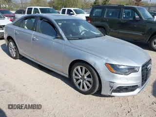2014 Audi A6 Prestige z VIN WAUHGAFC2EN003947, wystawiony jako IAAI lot #42217334 z przebiegiem 101 026 mil mil oraz . Historia ofert i sprzedaży dostępna na DreamBid. Obrazek 1.