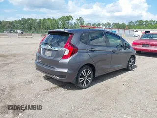 2019 Honda Fit EX z VIN 3HGGK5H89KM736677, wystawiony jako IAAI lot #42443401 z przebiegiem 58 559 mil mil oraz . Historia ofert i sprzedaży dostępna na DreamBid. Obrazek 4.