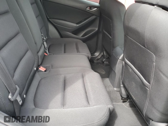 2016 Mazda CX-5 Touring with VIN JM3KE2CYXG0777715, listed as a Copart auction lot 52157005 with 58,585 mi miles and Salvage Title. Bid and sale history available at carsss.com. Image 11.